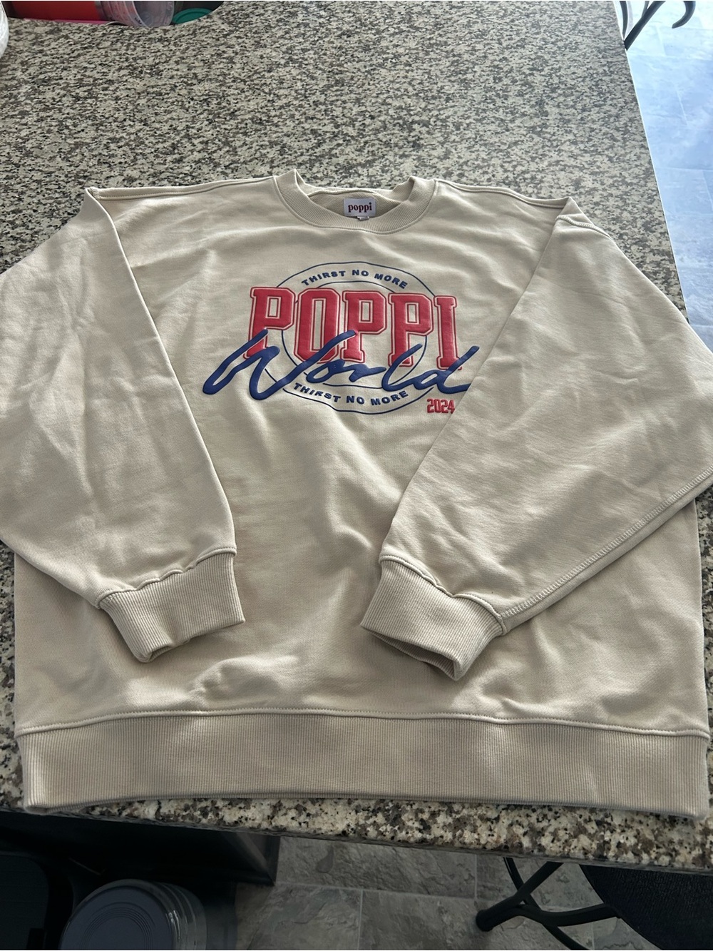 Poppi Cream Graphic Crewneck Sweatshirt with Red & Blue Logo